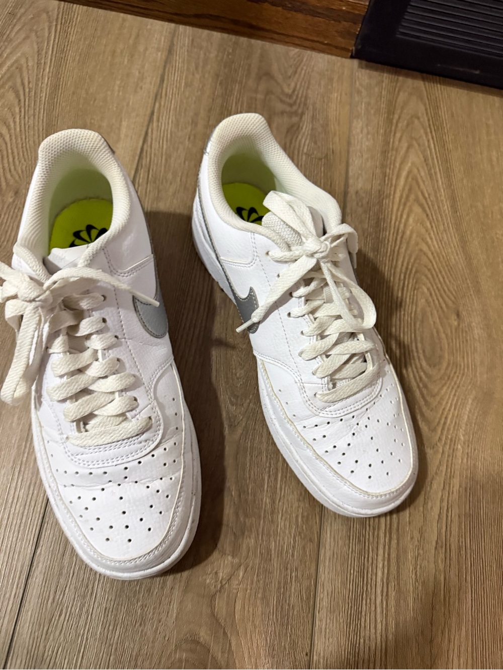 Nike White Low-Top Sneakers with Silver Swoosh and Neon Green Insole